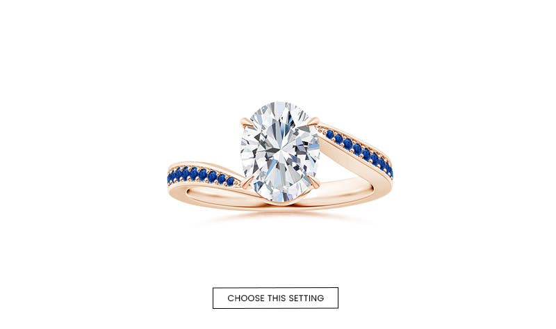 Oval Claw-Set Solitaire Bypass Blue Sapphire Studded Shank Engagement Ring